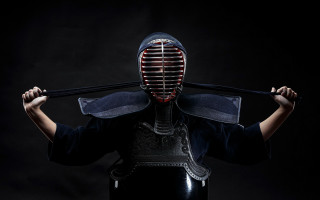 Masked character holding stick art - a stick free wallpaper