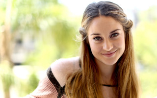 Woman smiling black shirt bokeh - seductive free wallpaper