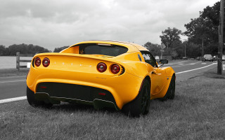 Yellow sports car tiltshift outdoors - a street sign free wallpaper