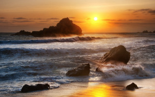 Sunset ocean rocks foreground sky - a sunset over the ocean free wallpaper