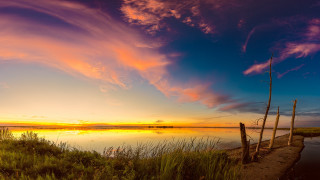 Sunset lake fence trees clouds - a sunset over a lake free wallpaper