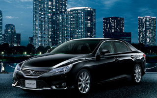 Black car tokyo night cityscape - a city skyline in the background free wallpaper