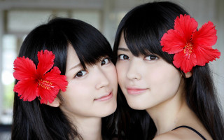 Two women red flowers photorealistic - facial free wallpaper