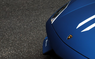Blue sports car yellow emblem - sharp detail free wallpaper