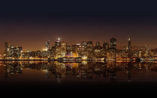 City skyline night reflection boat 2 - the water and a boat free wallpaper