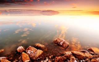 Rocky shore water sunset cloudy - a rocky shore free wallpaper