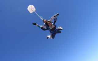 Woman parachute helmet blue sky - free happy birthday wallpaper