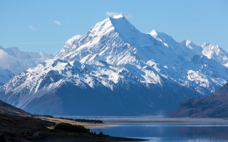 Mountain lake sky clouds beach - a mountain range free wallpaper