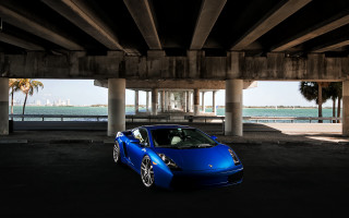 Blue sports car bridge ocean - a blue sports car free wallpaper for desktop