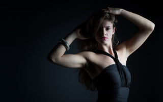 Woman blackdress posing portrait jewelry - her arm behind her head free wallpaper