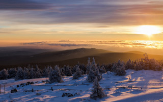 Sunset snowy mountain trees fence - a sunset over a snowy mountain free wallpaper
