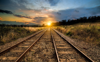 Train track sunset field mountains - the distance behind free wallpaper