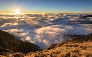 Mountain sun clouds grassy horizon - a view of a mountain free wallpaper