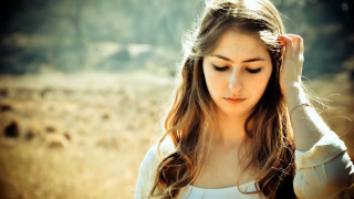 Woman field hair wind hands - a woman in a field free wallpaper