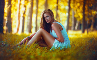 Woman sitting grass autumn fire - cinematic free wallpaper for desktop