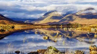 Lake mountains rocks birds clouds - a few bird free wallpaper