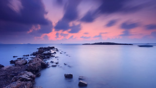 Long exposure sunset rocky beach - a long exposure of a sunset over a rocky beach free wallpaper