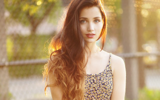 Woman long hair fence serious - the camera free wallpaper
