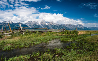 Wooden fence green field river - a wooden fence free wallpaper