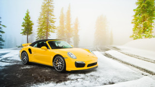 Yellow sports car snowy woods 2 - a snowy road free wallpaper