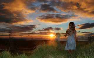 Woman sunset green field clouds - a fence free wallpaper