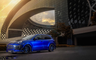 Blue car building sky bird - a blue car free wallpaper