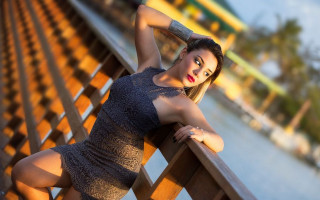 Woman bench water bridge fashion - a building in the background free wallpaper