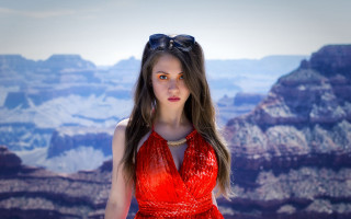 Woman red dress mountains sunglasses - a pair of sunglasses free wallpaper