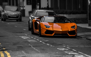 Orange sports car city street - nice free wallpaper