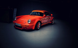 Red sports car dark garage 2 - a dark garage free wallpaper