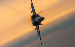 Fighter jet cloudy sunset backlit - the horizon behind free wallpaper