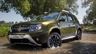 Green pickup truck driving through - a puddle of water free wallpaper