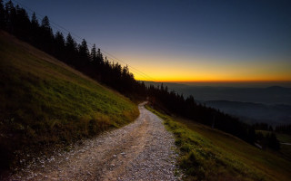 Dirt road hill sunset trees - a sunset in the background and trees free wallpaper