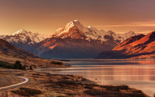 Scenic mountain range road lake - a scenic view of a mountain range free wallpaper
