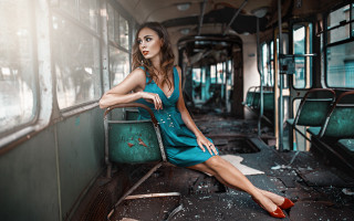 Woman blue dress train seat - a train car free wallpaper