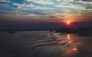 Sunset water boats clouds river - river free wallpaper