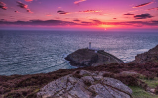 Lighthouse rocky cliff ocean sunset 11 - a rocky cliff free wallpaper