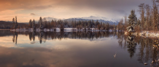 Lake mountains trees cloudy sky 50 - tree and mountains under a cloudy sky free wallpaper