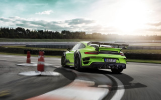 Green sports car race track 3 - a green sports car free wallpaper