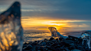 Bottle rocky beach sunset ocean - the sun setting free wallpaper