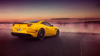 Yellow sports car water sunset - a pink sky free wallpaper