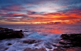 Sunset ocean wave boat city - the water below free wallpaper