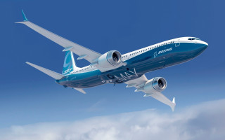 Large blue and white airplane - a blue sky background free wallpaper