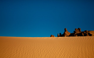Desert rocks blue sky foreground - a blue sky in the background free wallpaper for desktop