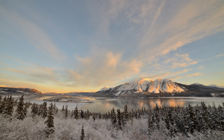 Mountain lake trees sunset clouds 4 - the foreground and a sunset in the background free wallpaper