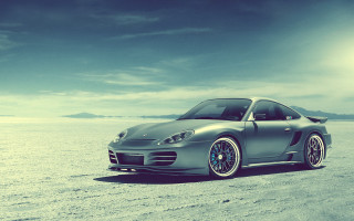 Silver sports car beach cloudy 2 - grey background free wallpaper