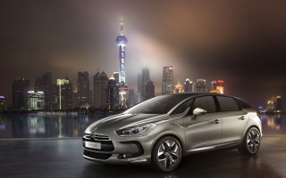 Silver car city skyline night - a silver car free wallpaper