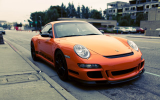 Bright orange sports car city 3 - the side of the road in front free wallpaper
