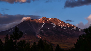 Mountain snow capped trees sunset - dramatic free wallpaper
