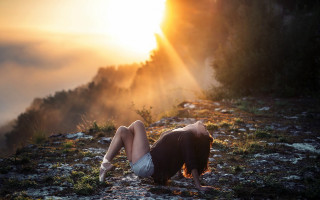 Woman rocky hillside sunset cinematic - a rocky hillside free wallpaper